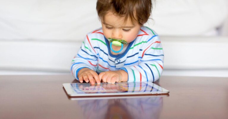 toddler with tablet